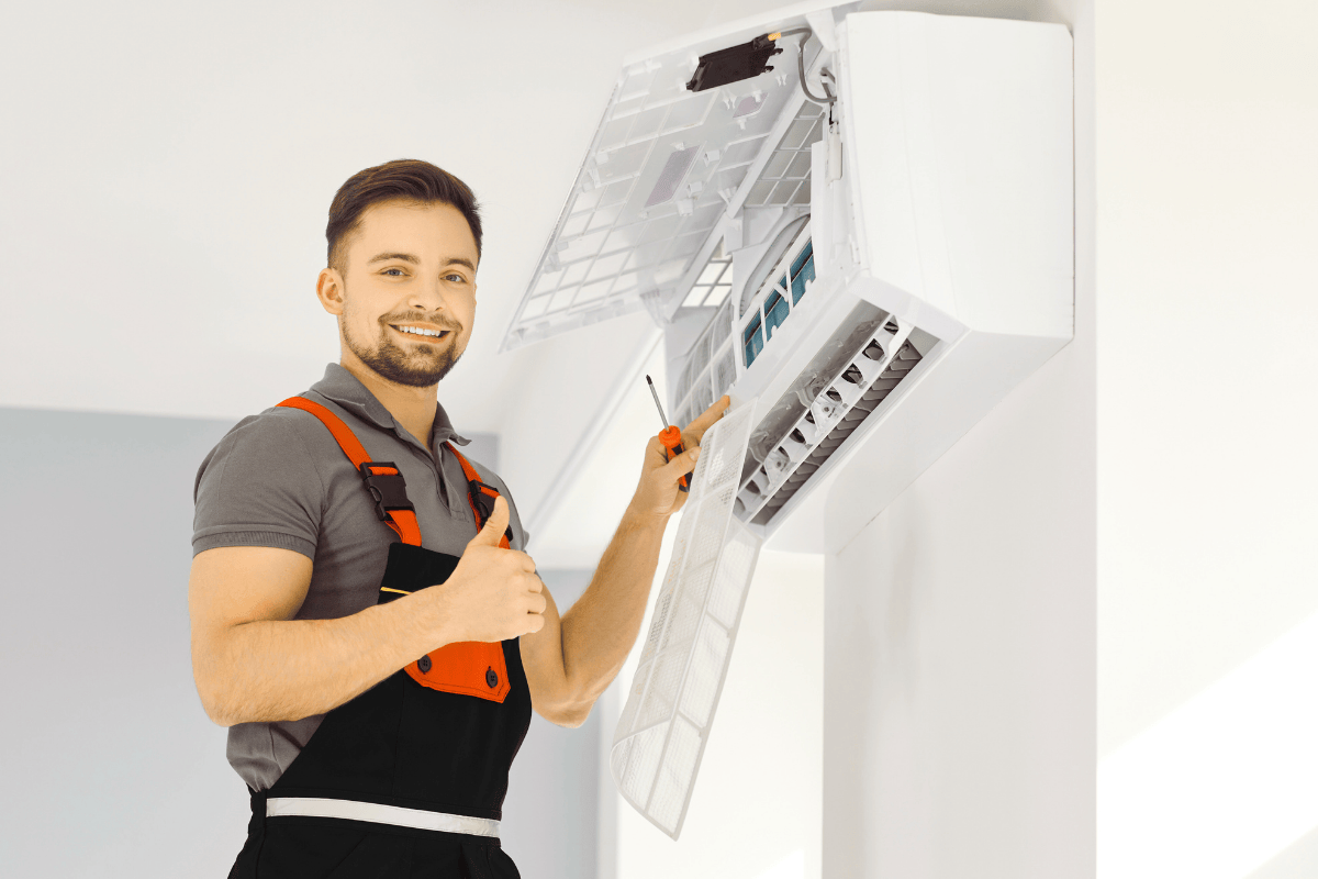 man fixing ac